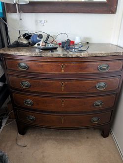 Nice four drawer dresser with heavy marble top.