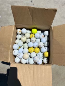 Box full of golf  balls