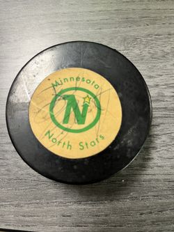 Official Minnesota Northstar game puck signed by Bill goalsworthy