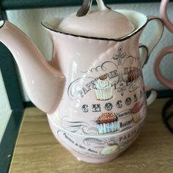 Cute pink teapot and teacup set