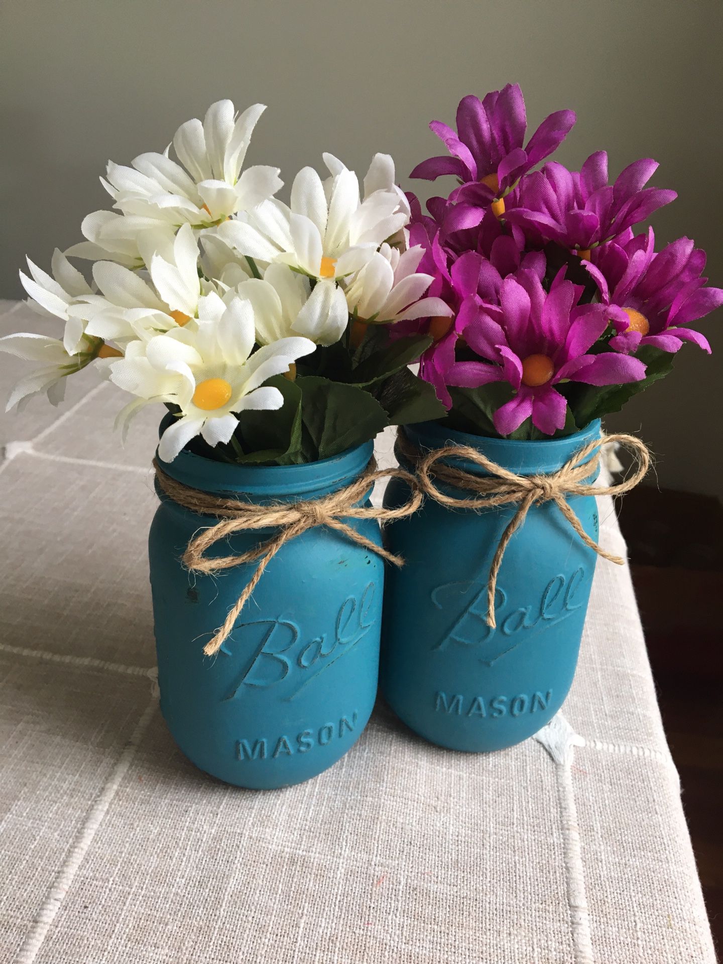 Distressed mason jar vases with silk flowers included! You choose the jar/flower colors $12 for both