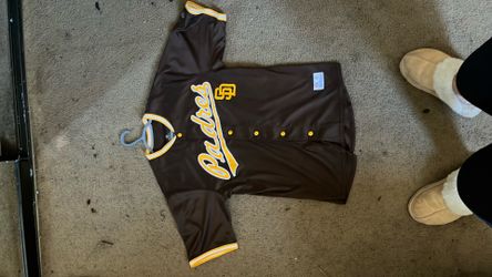 Padres jersey size medium and 2 padre hats