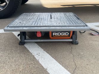 RIDGID 6.5-Amp 7 in. Corded Table Top Wet Tile Saw (Model R4021), featuring a grey tabletop and an orange motor housing