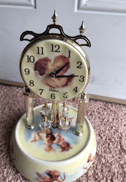 An exquisitely beautiful Angel Clock. With for Crystal spinning balls It works great.