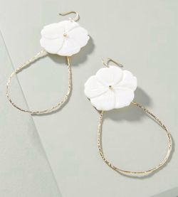 gold-toned drop earrings featuring hand-carved white mother-of-pearl shell flowers