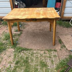 wood table its 30 inches tall 47 inches wide and 33 inches deep