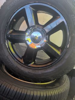 20 inch chevy siverado black wheels w (contact info removed) tires 2 cooper and 2 lexany all terrain