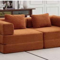 The double sofa, with its comfortable and soft design, is suitable for the living room.