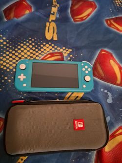 Nintendo Switch Lite with 1 physical game, its case, and charger; in very good condition