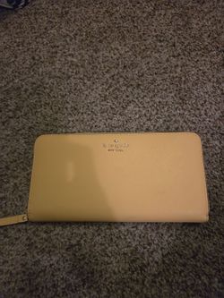 Butter yellow Kate Spade wallet. New. No tags