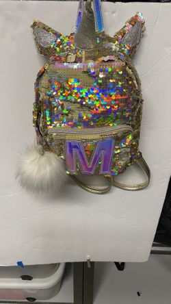 Justice girls gold unicorn backpack M logo