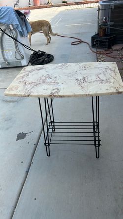 Metal frame with marble top table