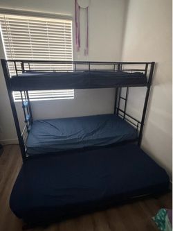 Bunk bed with third slide in bed
