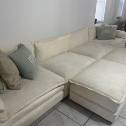 Large beige sectional couch 8 seater with 2 foot rest ottoman
