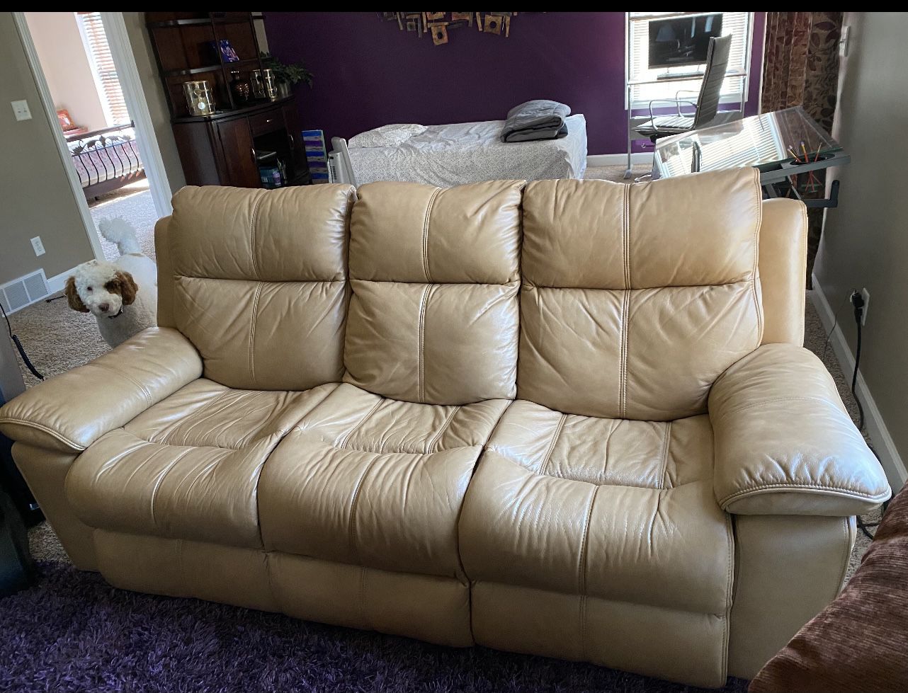 Tan leather sofa set is for sale Ana- they are power recliners. Price 1600