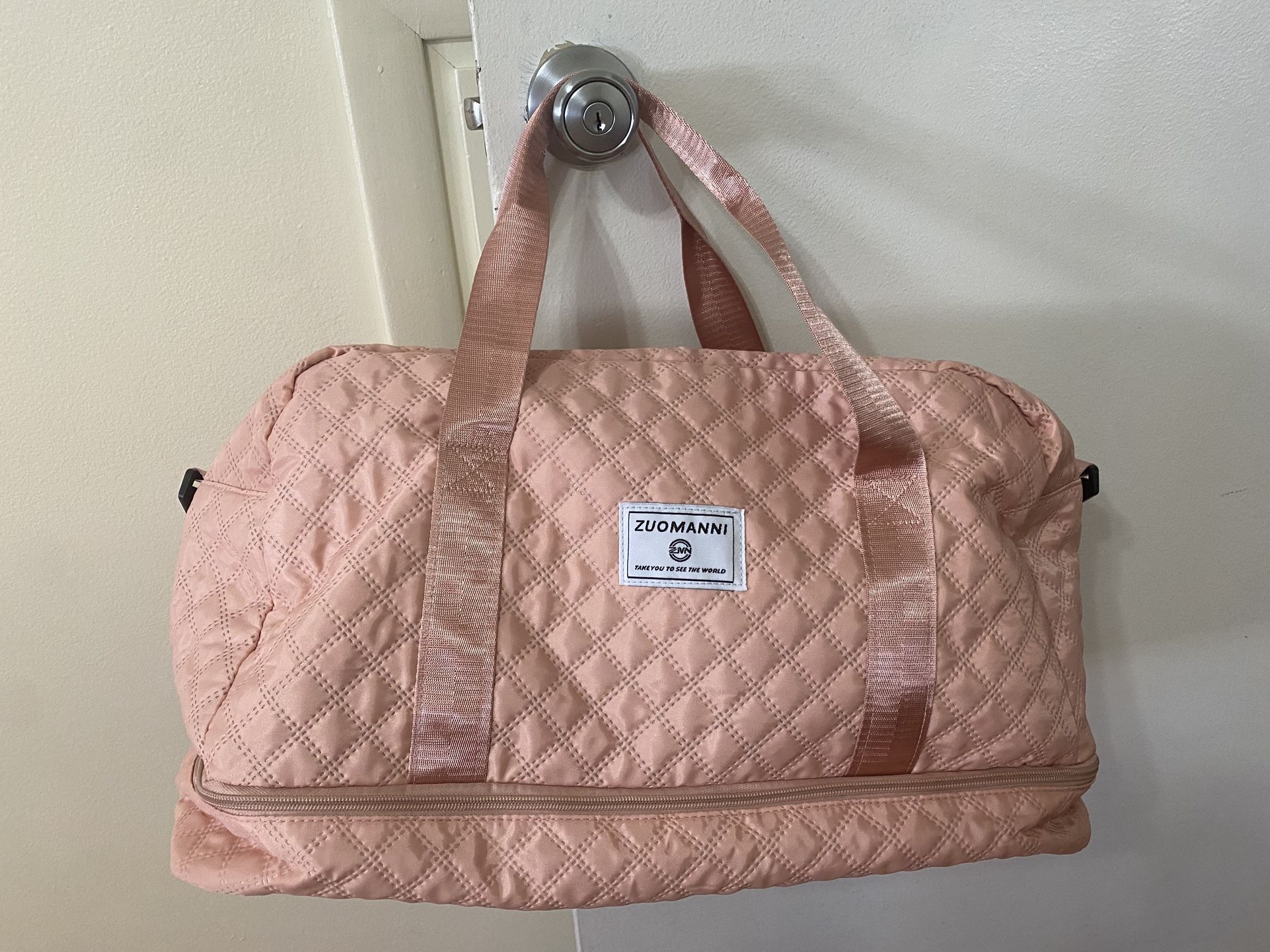 Zuomanni brand duffel bag