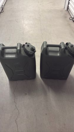 Two green 5 gallon heavy duty water containers
