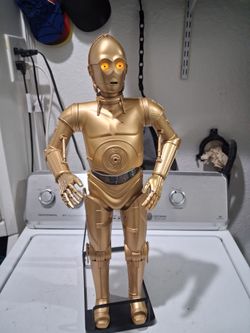 rare talking and articulated C3PO Star wars action figure.  21 inches tall. Good condition. Disney  " Lucasfilm".