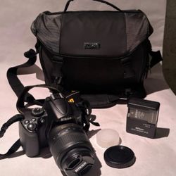 Nikon D5000 with 18-55mm lens charger battery 8gb card and case.