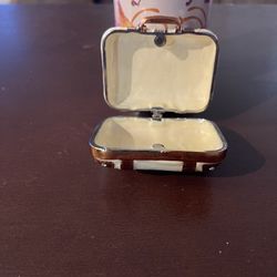 This is a Suitcase Jewelry Box, a charming and functional collectible piece. 