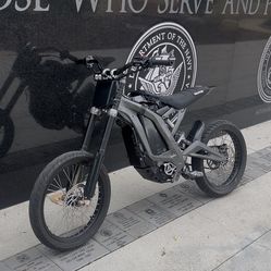 Registered SURRON LBX with sumos and dirt wheel set