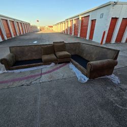 REAL LEATHER COUCH WITH BRASS PINS AT THE TOP AND GOOSE DOWN FEATHER FILLED CUSHIONS