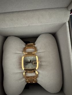Gucci woman’s gold stainless steel watch
