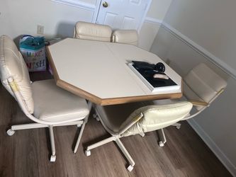 Dining room table with rolling chairs
