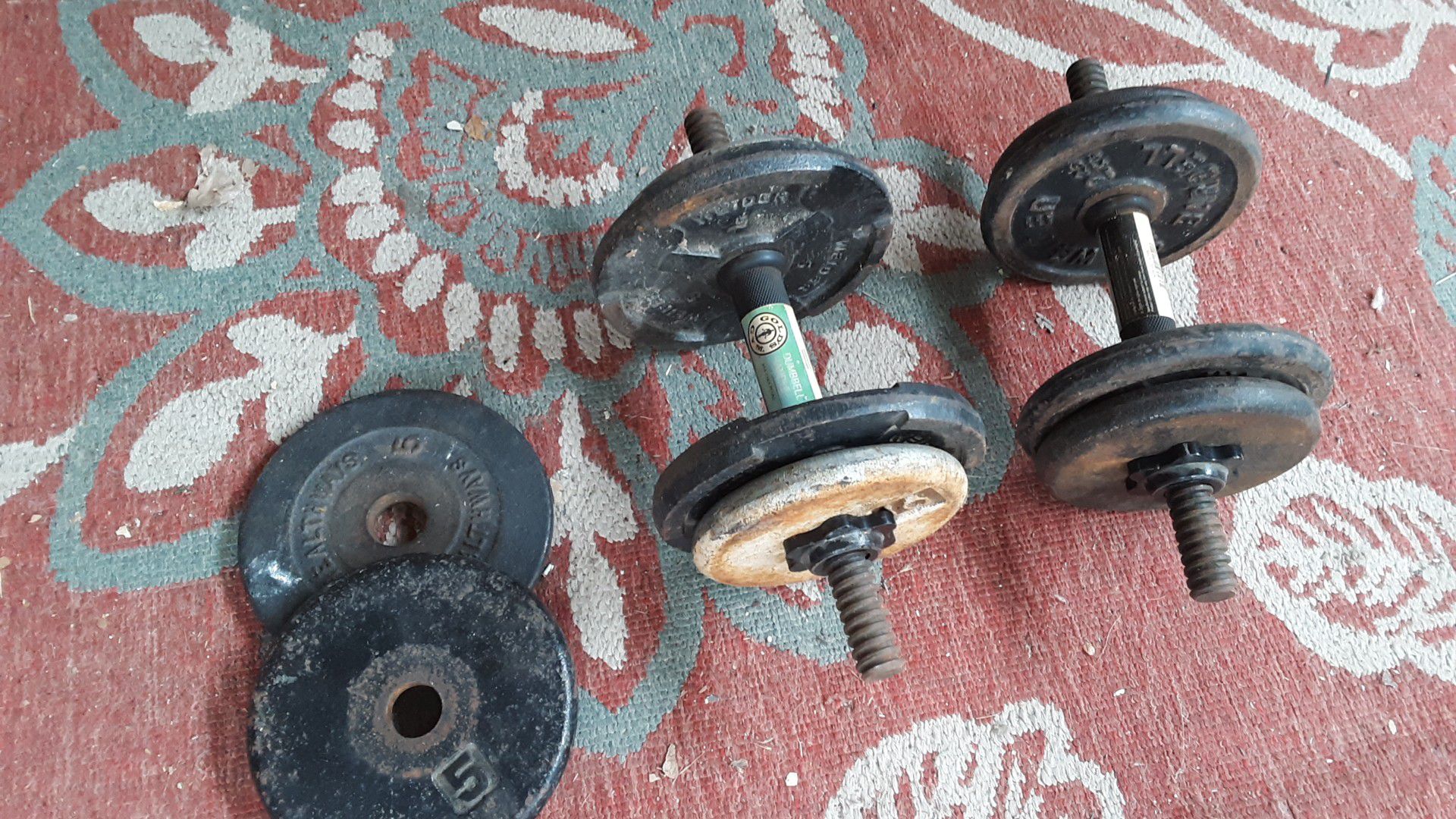 Barbells/dumbbells 50 lbs in weights and hand bars included