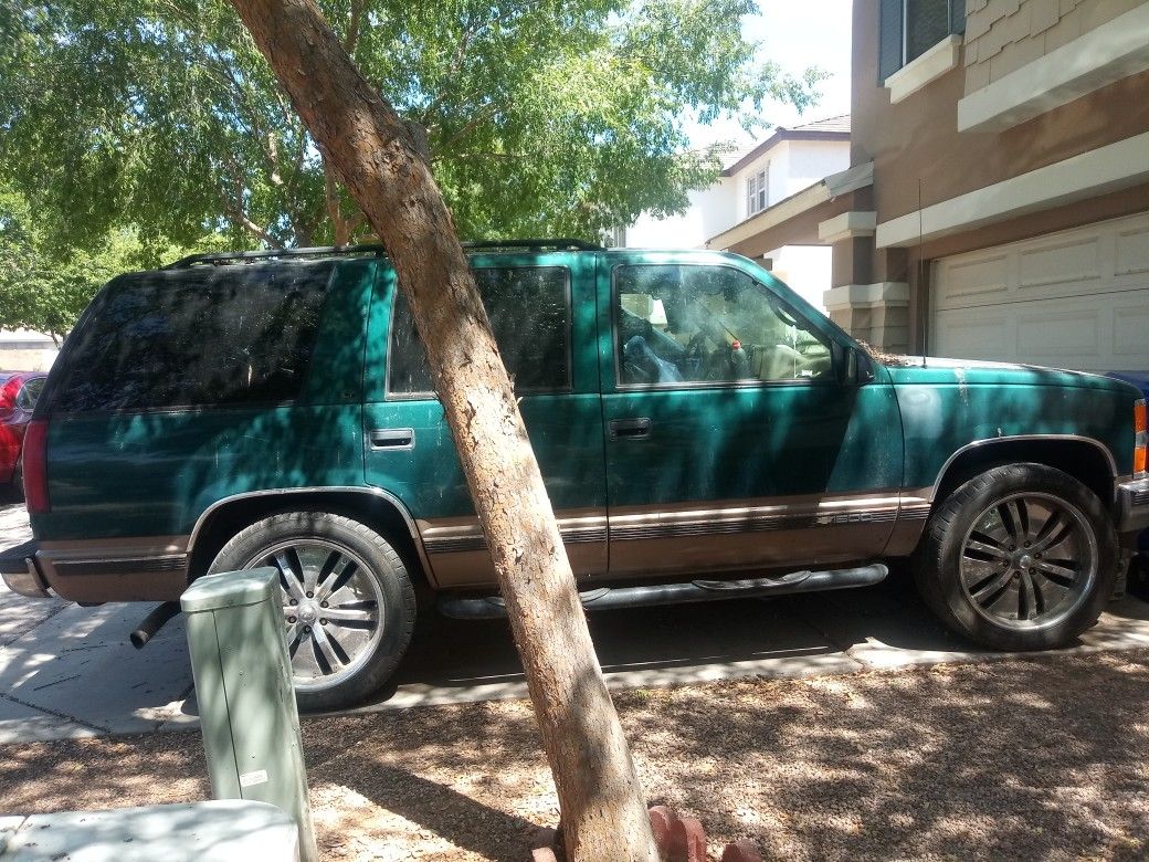 1995 Chevy Tahoe..honesly when it got a problem i just decided to get a car that 4 my babies 4 car seats.dent in 1 door Take it with the rims & tires