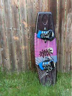Hyperlite wakeboard features a vibrant pink and blue sunset graphic with palm tree 134cm