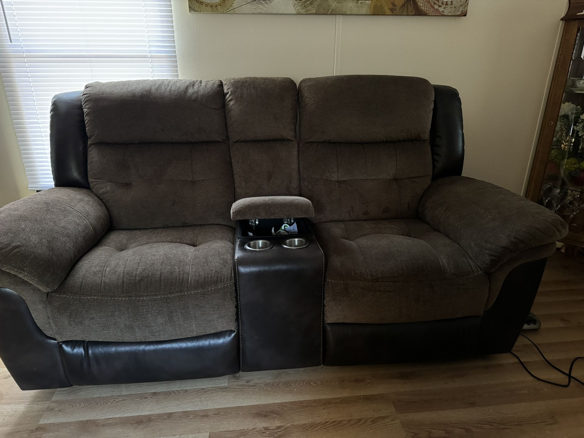 I am selling a two-seater reclining sofa in perfect condition