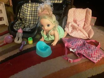 Baby alive and stroller with baby accessories