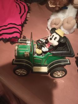Have three mickey mouse cars , they're ten , they wind up and go by themselves in perfect conditions , still have tags on them from the seventies