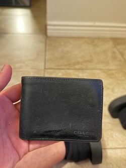 black leather Coach billfold wallet