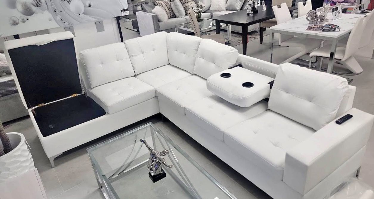 white sectional sofa with storage and cup holders