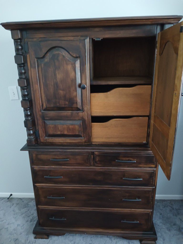 Armoire;  54" tall, 40" wide, 19" deep. 