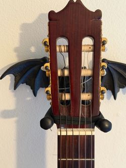 Bat wing guitar holder