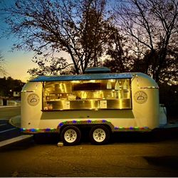 2023 Dual-Axle Food Trailer — Ansel fire suppression, 4-burner range/top, charbroiler, deep fryer, triple sink, 30 gal fresh / 20 gal gray, 30A 120/24
