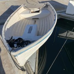 Rowing Dingy.  Or Sailing But No Sail Or Mast 