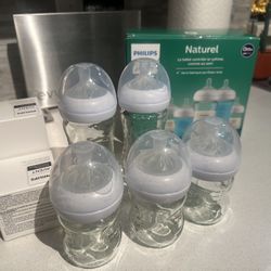 Baby Bottles 0m-1m+, size 1 diapers, assorted pacifiers, baby wipes warmer