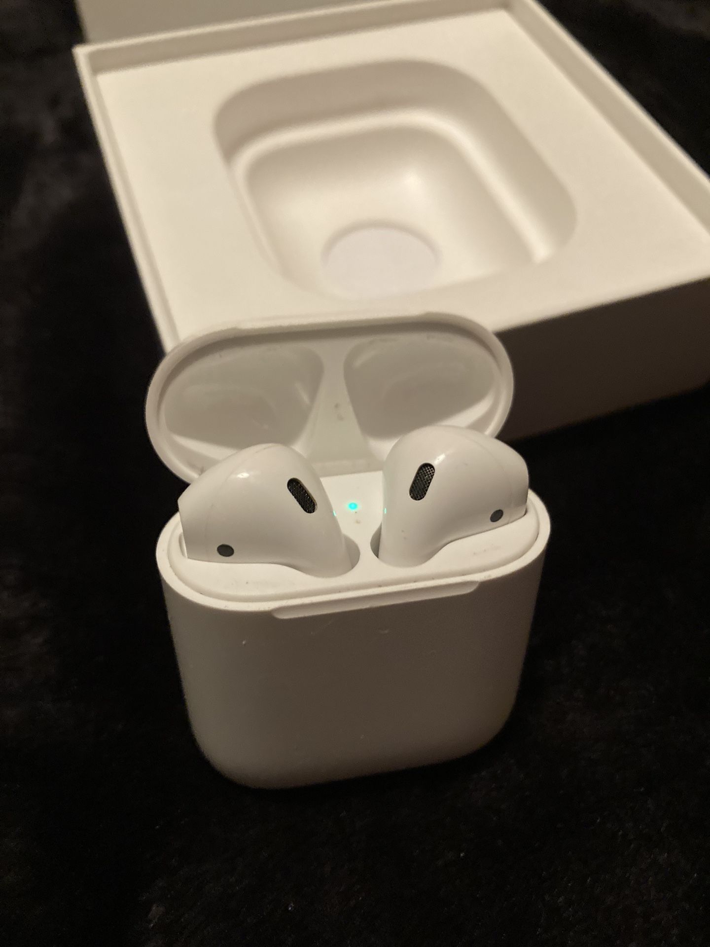 Apple Airpods w/ Charging Case.
