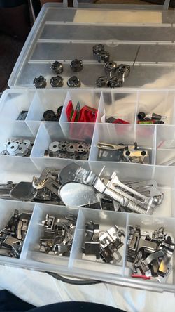 Sewing machine, parts, spools needles all for $60