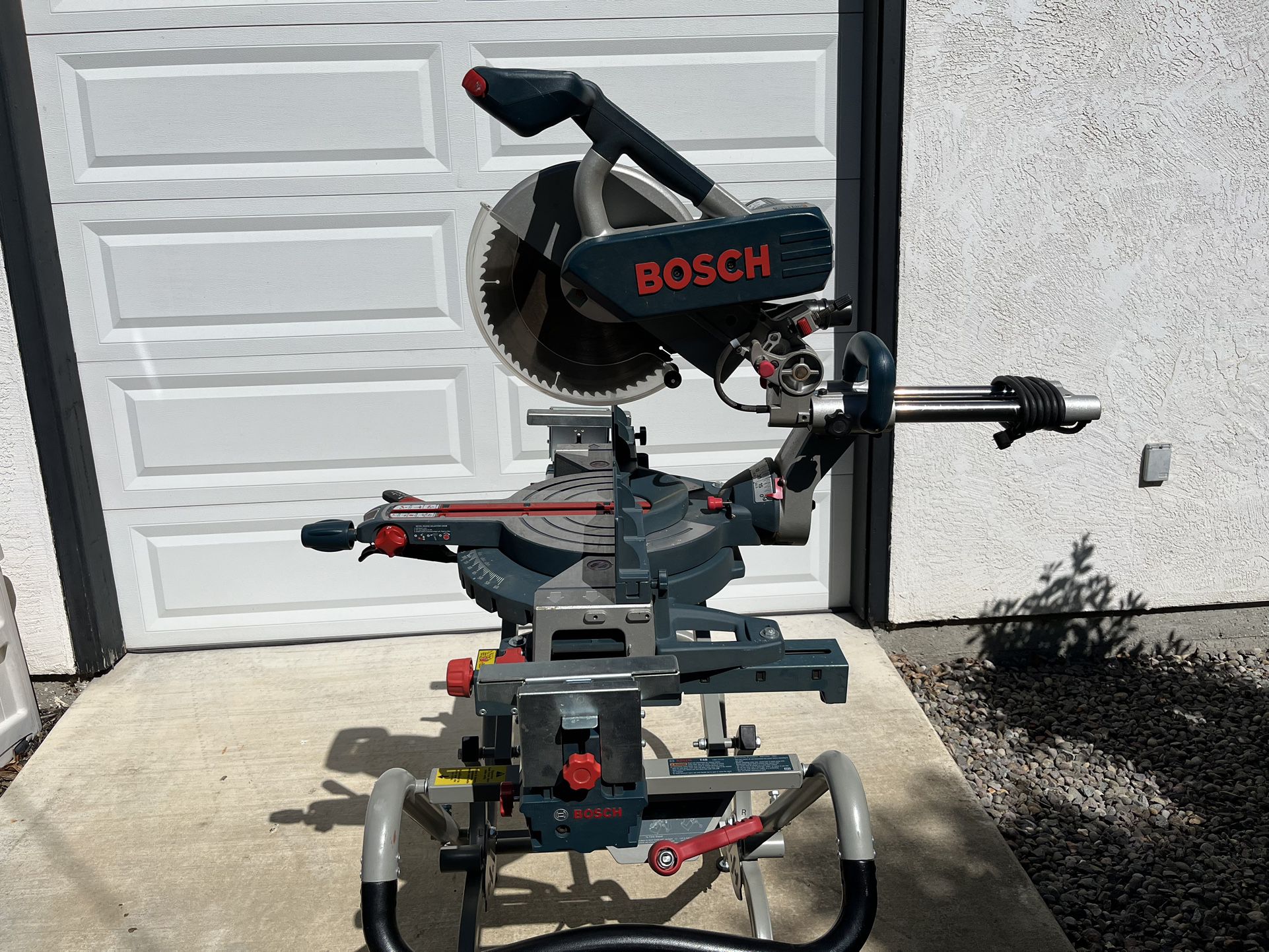 Bosch 5312 - 12” Dual Bevel Slide Miter Saw And A Bosch T4B Gravity Rise