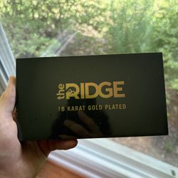 Sealed 18 Karat Gold Ridge Wallet 