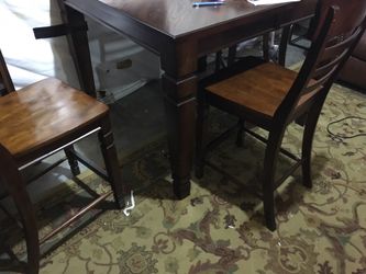Counter height dinning table and 6 chairs