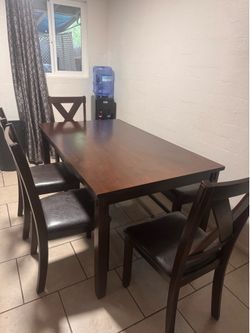 Table with 4 chairs and  a bench