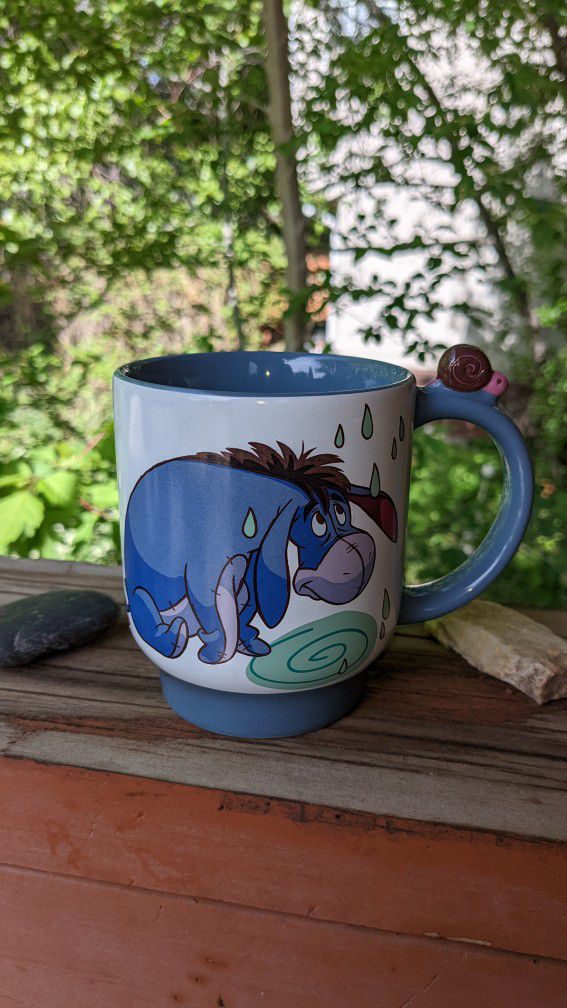 Disney store Vintage Eeyore Mug With Snail On The Handle.

In excellent condition. It was displayed, not used.

No chips or cracks.

