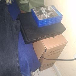 PS4 slim 4 Games And Controller Charger. Negotiable