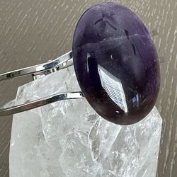 New, beautiful Amethyst Crystal platinum plated bangle bracelet. Shipping available.